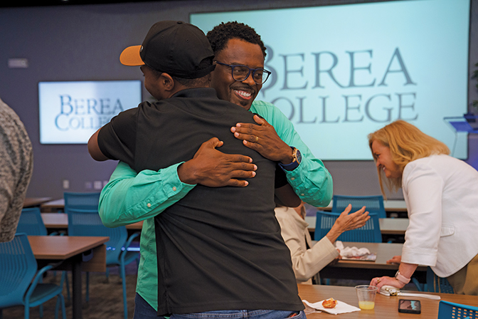 Two men hugging in greeting