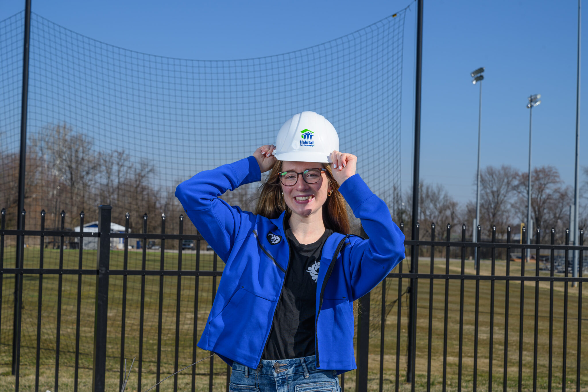 Portrait of Summer Bahr wearing a Habitat for Humanity hard hat