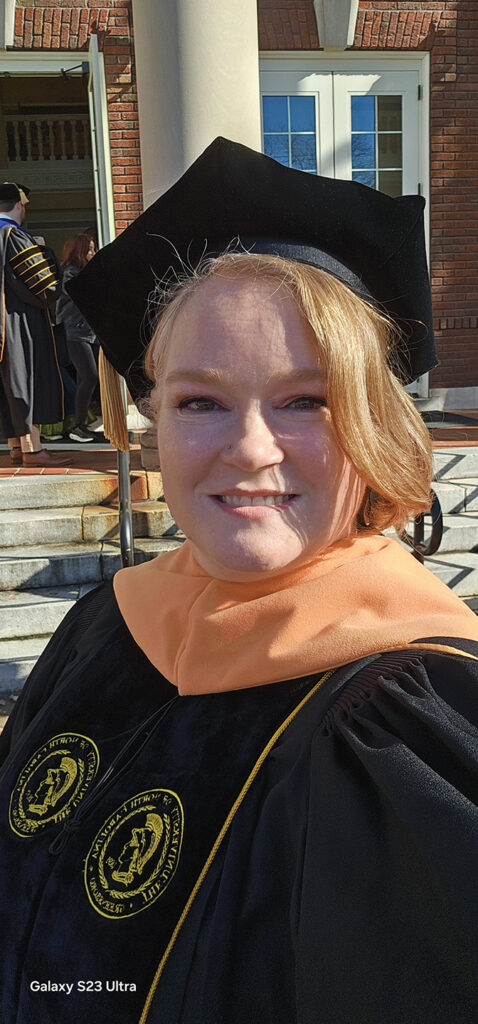 photo of Angela Patterson Klett in commencement regalia
