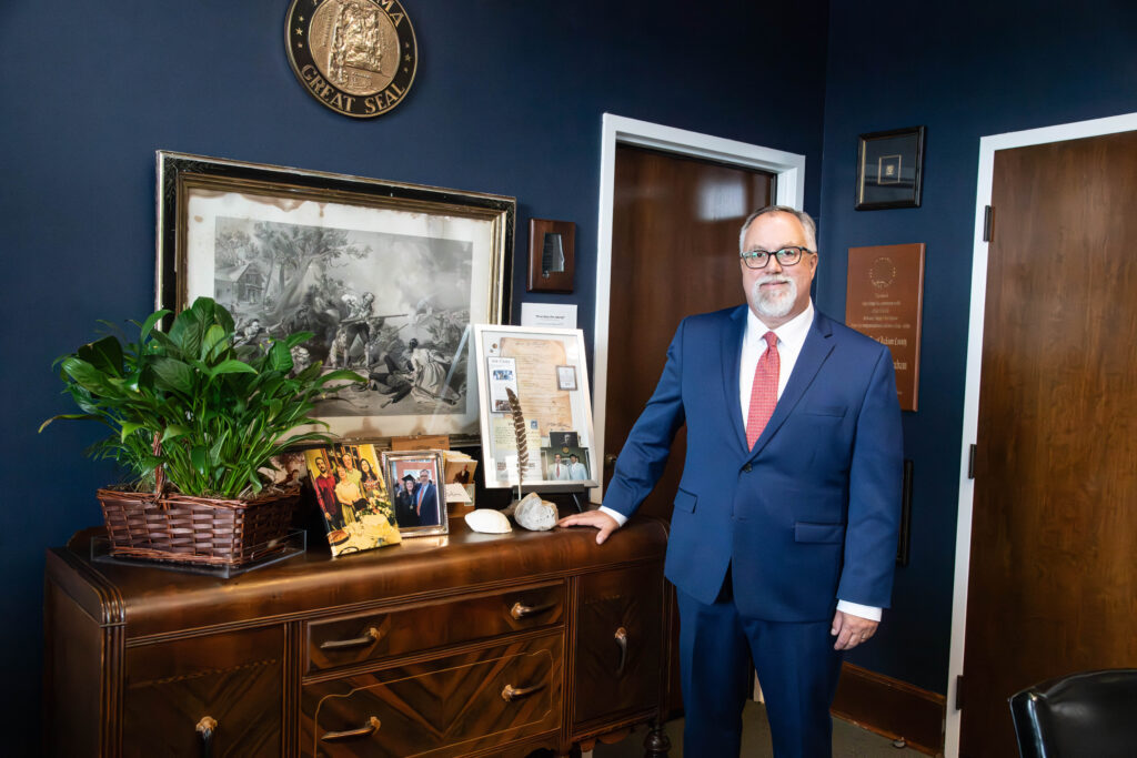 Judge John Graham standing in his office