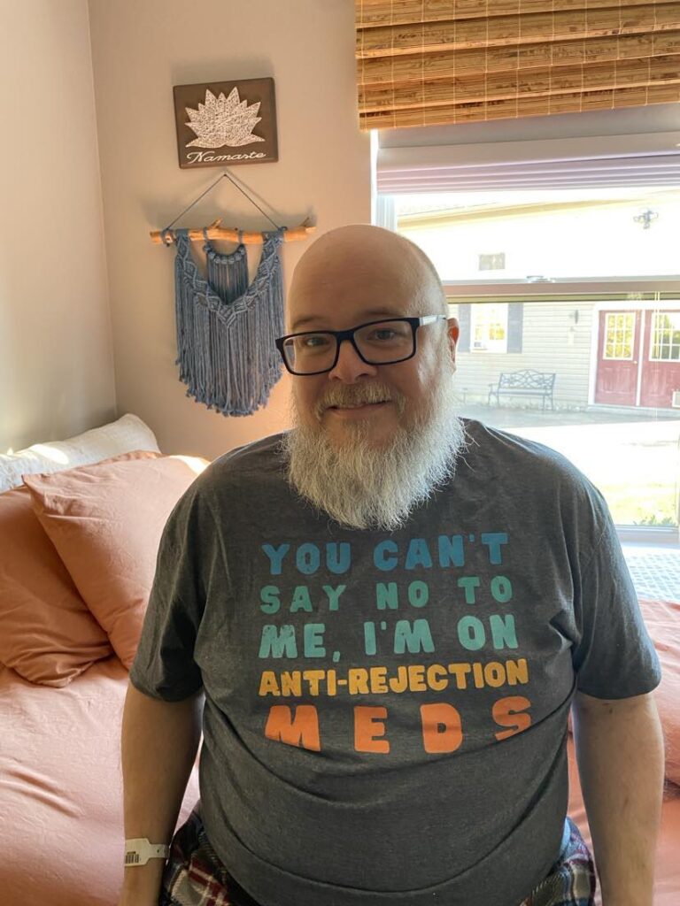 Photo of Marc Gustwiller wearing a shirt that says You can't say no to me, I'm on anti-rejection meds
