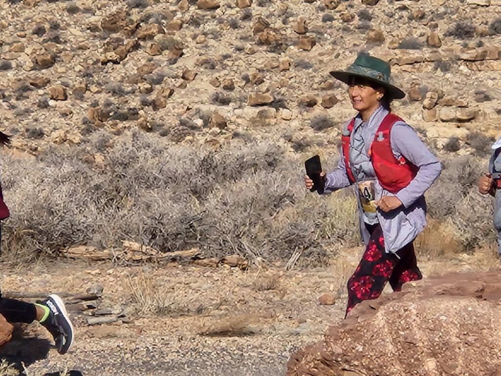 Penelope Wong running in a desert setting