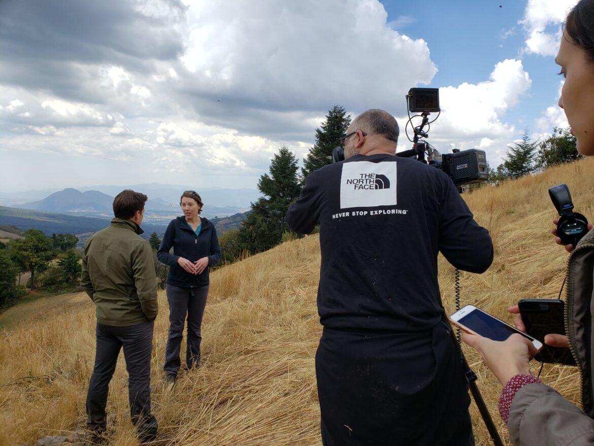 Conservation and Community Building Tierra Curry being interviewed on a hillside for a CBS morning show