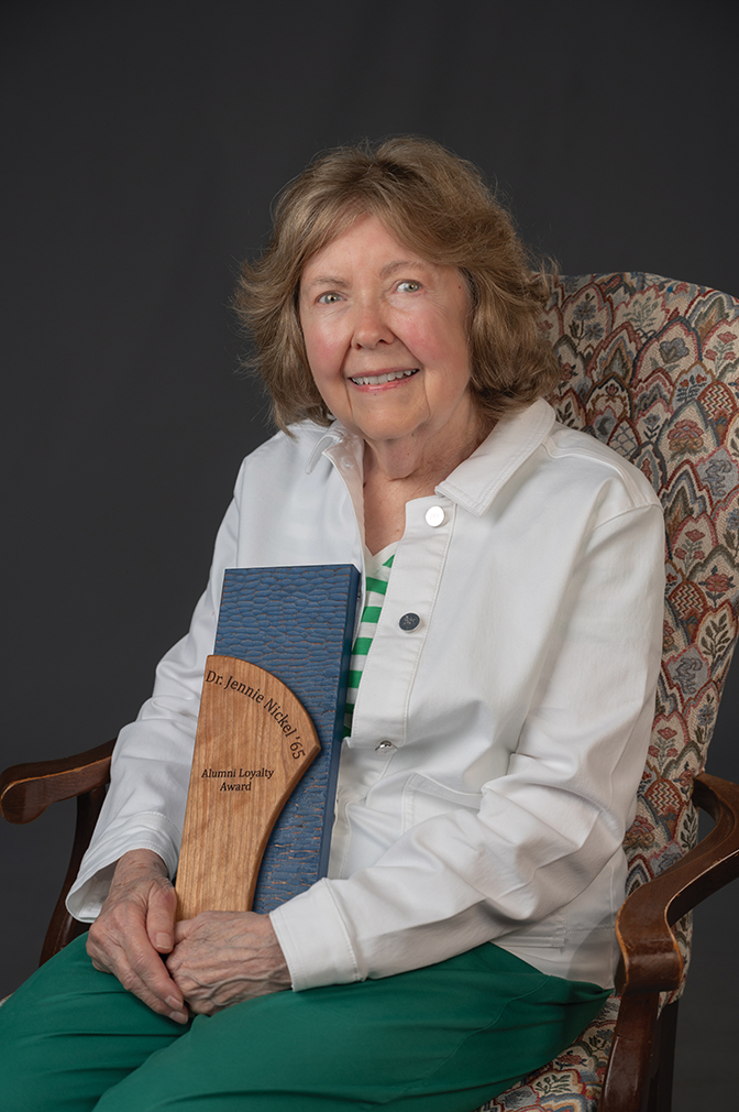 Portrait of Jennie Nickel '65 holding her alumni award