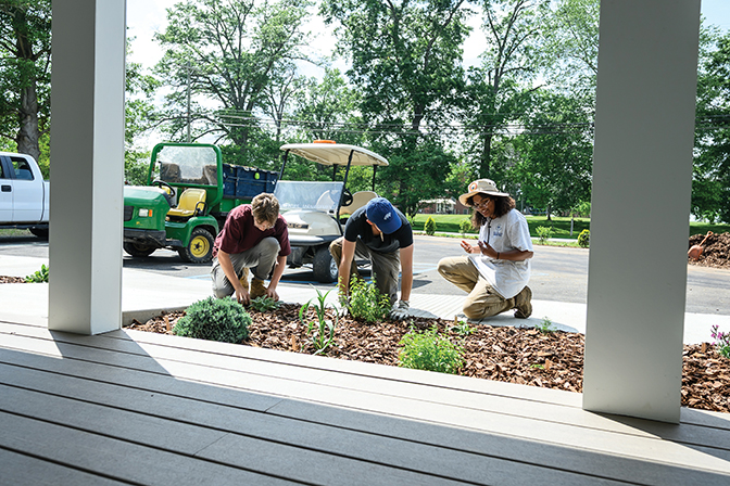 Autumn '28 and two other members of the Berea Grounds crew assist her in bringing her landscaping design to life.