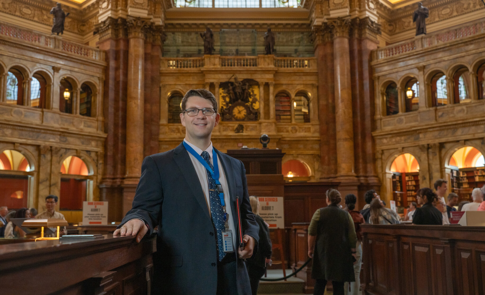 Sid Ferguson-English stands in the Library of Congress.