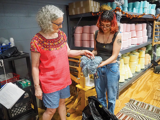 Student, Bella, works on dyeing fibers with mentor Sarah Broomfield '08