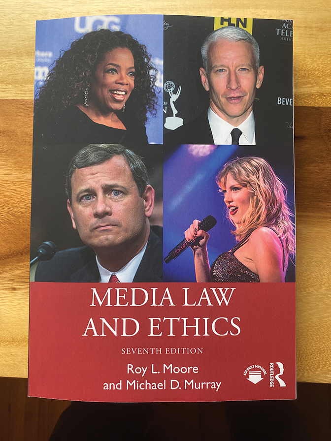 Cover of the book "Media Law and Ethics" by Roy L. Moore.