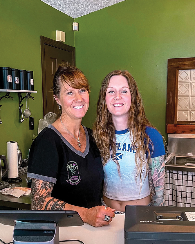 Portrait of Amy Hoggard Vanderpool standing with her daughter, Molly.