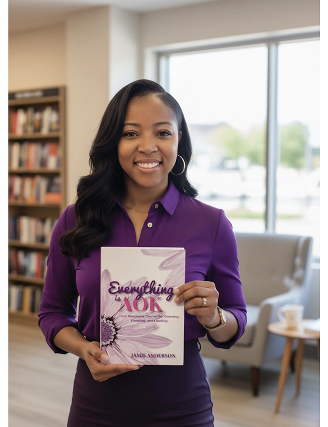 Portrait of Jamie Anderson holding her book, "Everything is AOK Teen Keepsake."