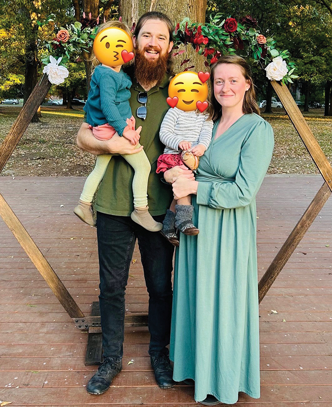 Photo of Seth Teegarden and Brenna Robinson-Teegarden holding two children whose faces have been covered up.