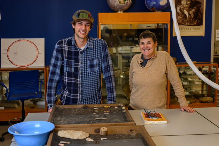 Zeke '26 and Dr. Broughten Anderson standing together in a workshop.