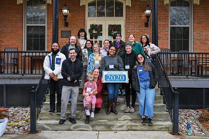 Members of the class of 2020 stand in front of Fairchild hall.