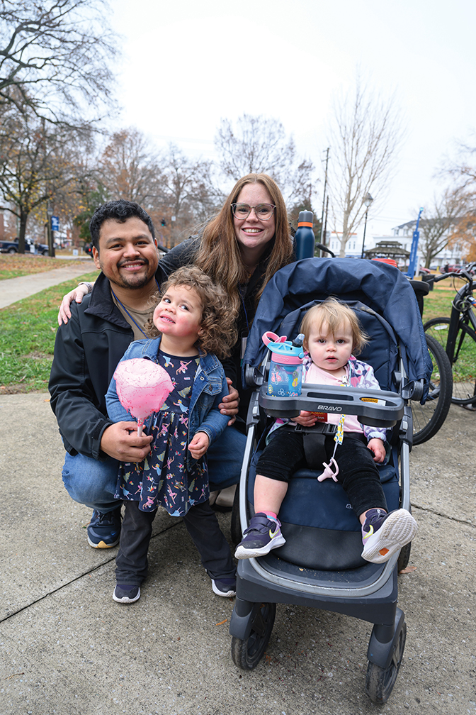 A family with two young children smile at Berea Fest.