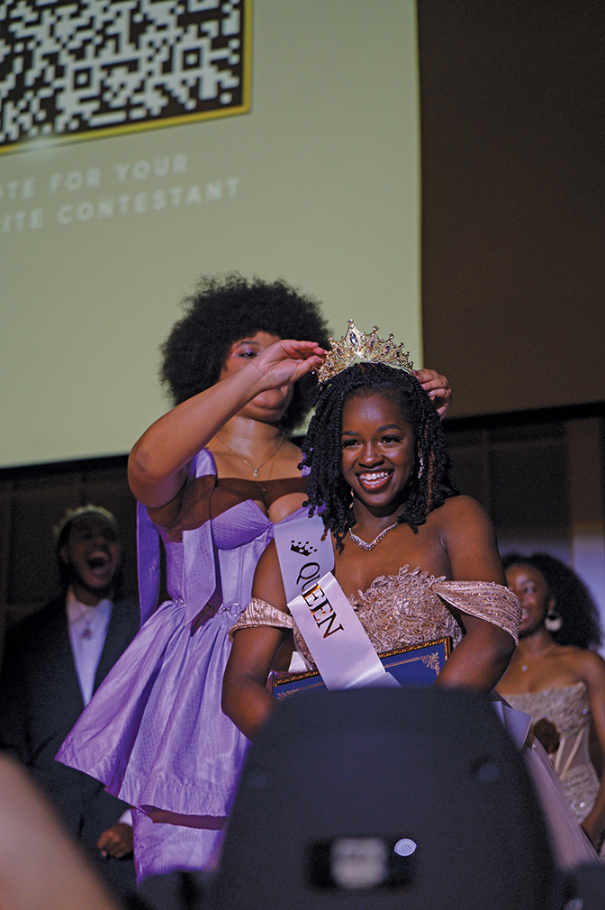 A Black, female student is crowned at the Black Student Union pageant.