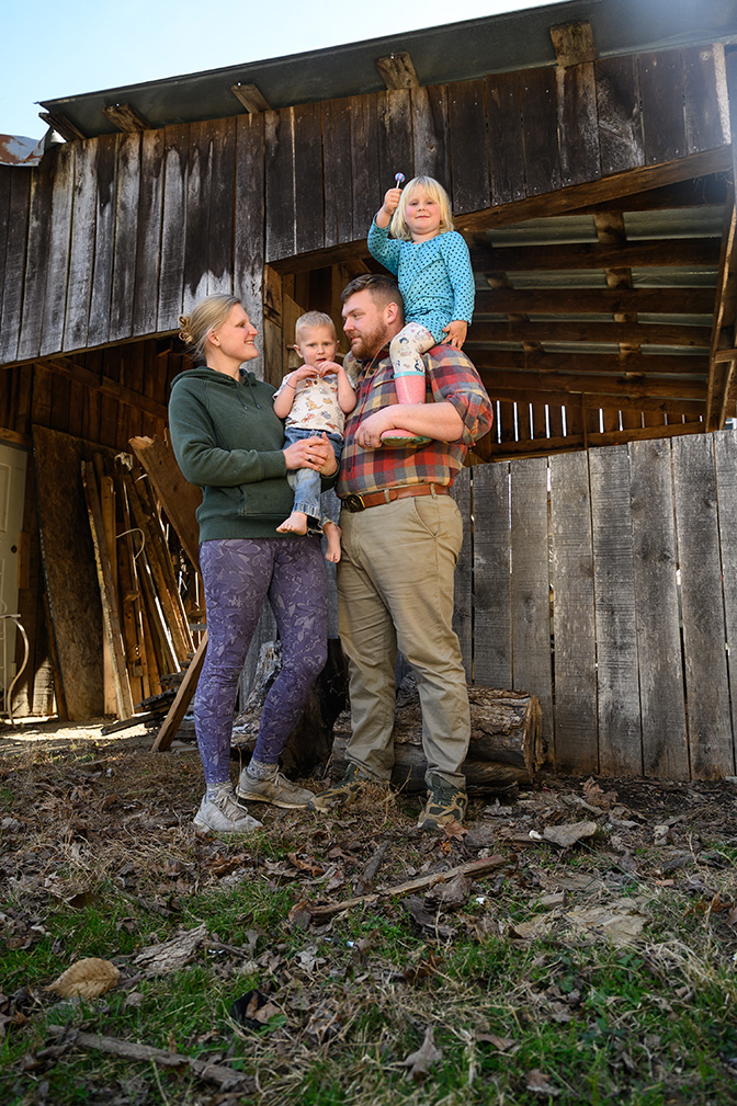 Candid photo of Matt Parsons with his wife and children.
