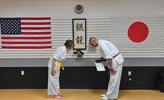 Finding New Purpose in Retirement Judith Weckman and her karate instructor bow to one another.