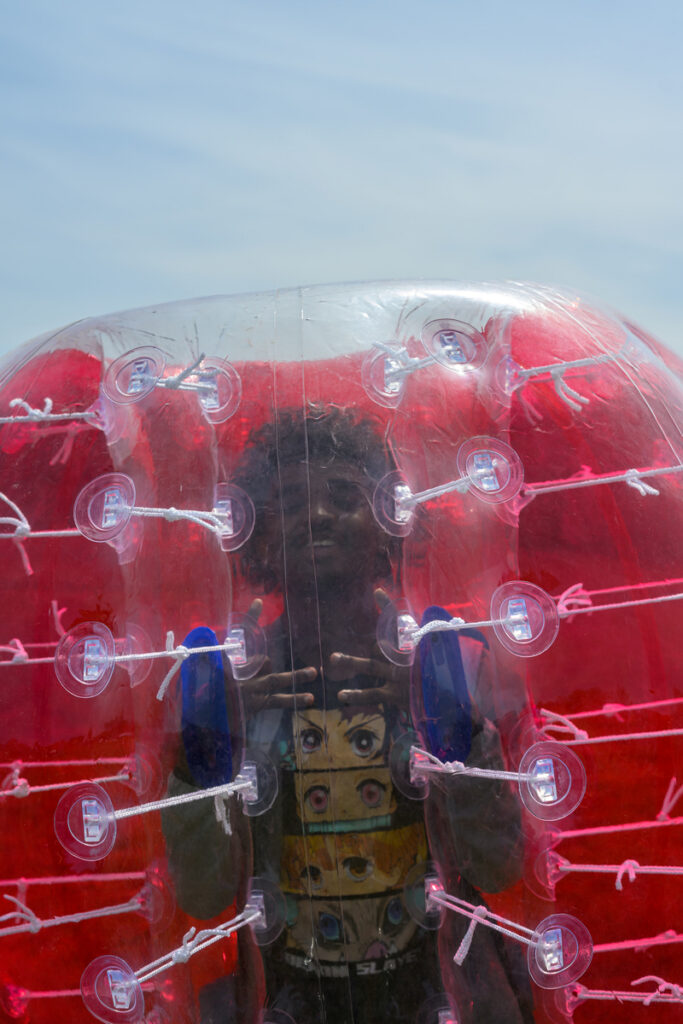 Student inside of a large bubble as part of the field games