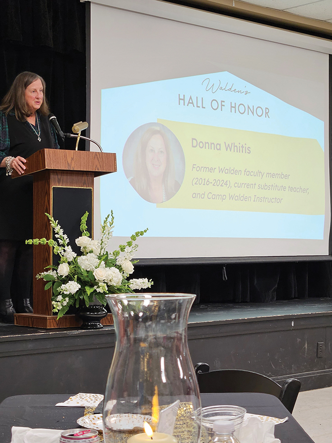 Photo of Donna Chatham-Whitis talking a a podium as she accepts an award