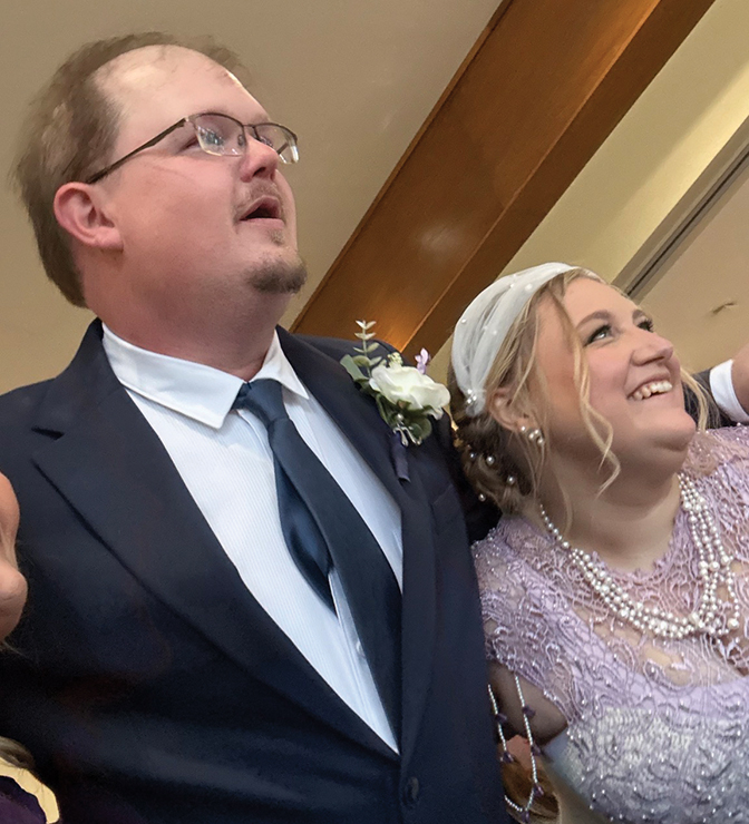 Photo of Priscilla Henken and Brian Thomas at their wedding