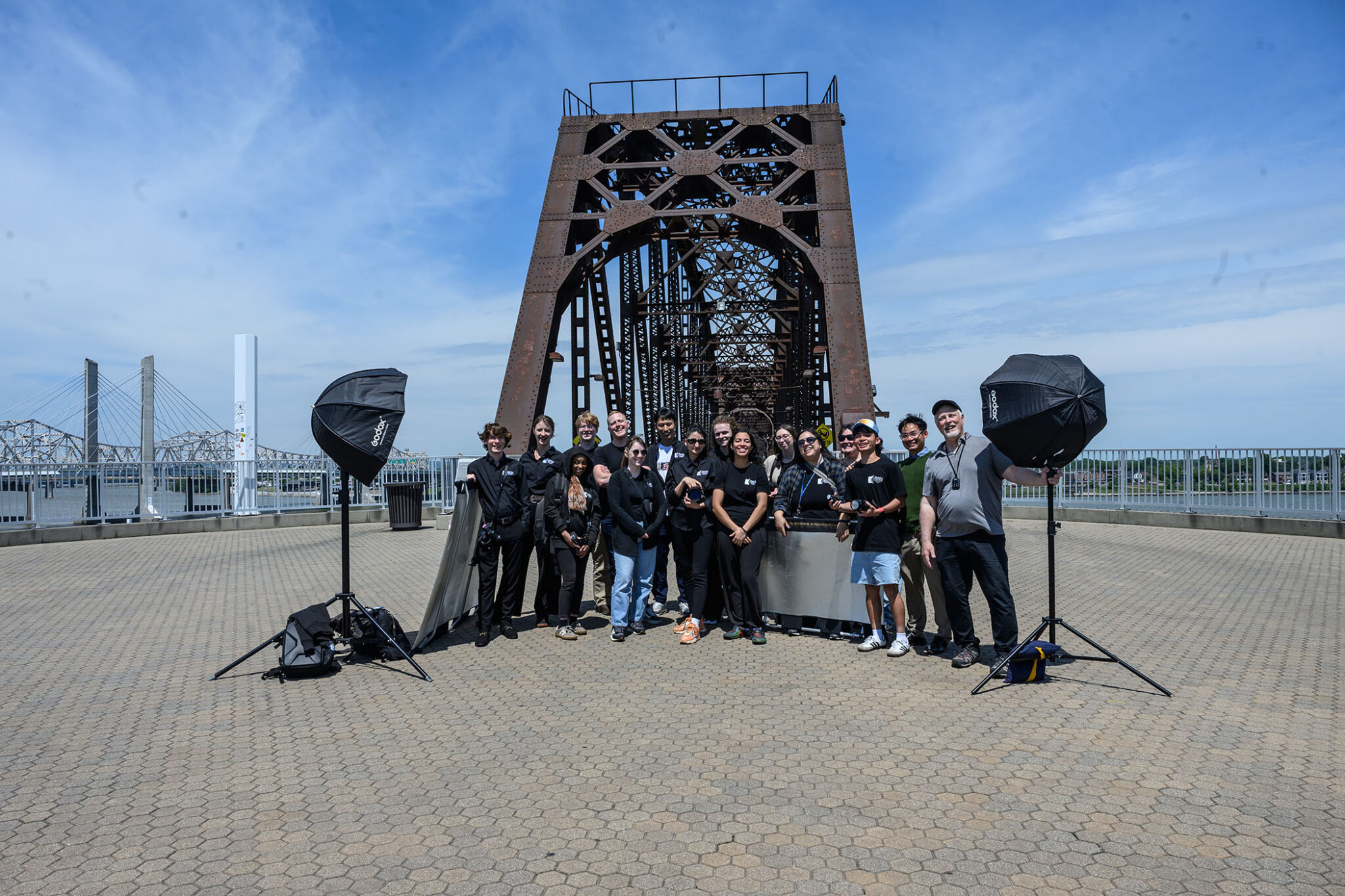 O'Neil Arnold '85 poses for a group photo with Berea College Multimedia students and staff on a walking bridge in Louisville, Kentucky.