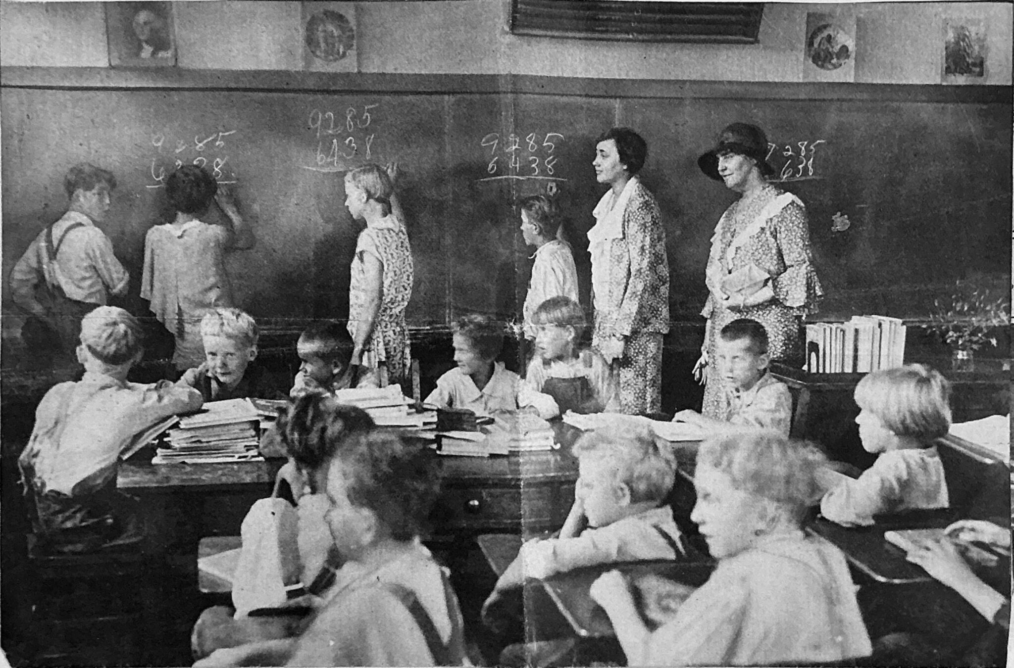 A Classroom in the Mountains Newspaper clipping depicts Christine Vest with students in black and white.